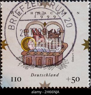 DEUTSCHLAND - UM 1999: Eine Briefmarke aus Deutschland, die ein Bild der Weihnachtskrippe als Weihnachts-Briefmarke zeigt Stockfoto