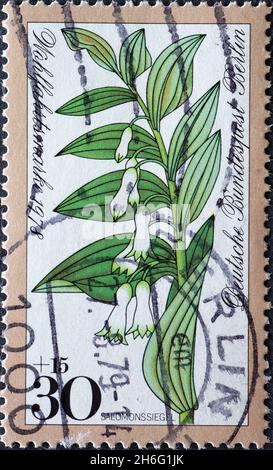 DEUTSCHLAND, Berlin - UM 1978: Eine Briefmarke aus Deutschland, Berlin zeigt eine Salomssiegelfabrik auf einer Spendenpostmarke Stockfoto