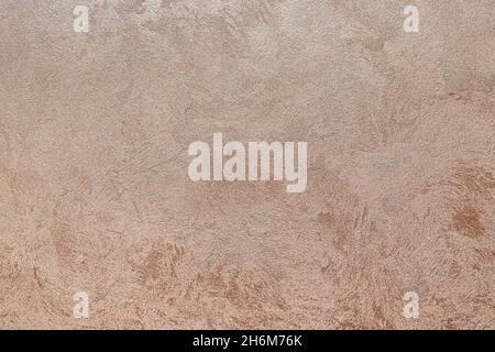 Strukturierter Hintergrund. Dekorative Gipswände, Außendekoration der Fassade. Textur aus beige, rosa. Stockfoto