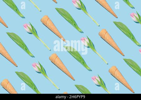 Kreatives Frühlingsmuster mit Eiszapfen, rosa Tulpen und grünen Blättern auf blauem Hintergrund. Stockfoto