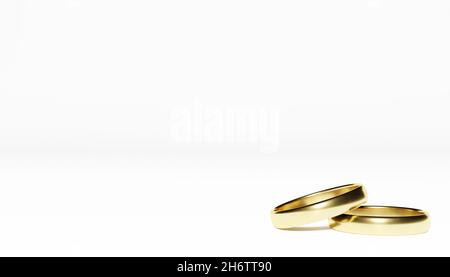 Goldene Hochzeit Ringe auf weißem Hintergrund Stockfoto