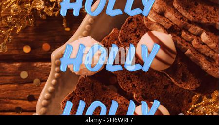 Bild von Stechstacheltext in Wiederholung über weihnachtsschmuck. weihnachten, Winter, Tradition und Feierkonzept digital generiertes Bild. Stockfoto