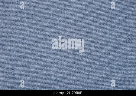 Hellblauer Denim-Stoff mit Textur im Hintergrund Stockfoto
