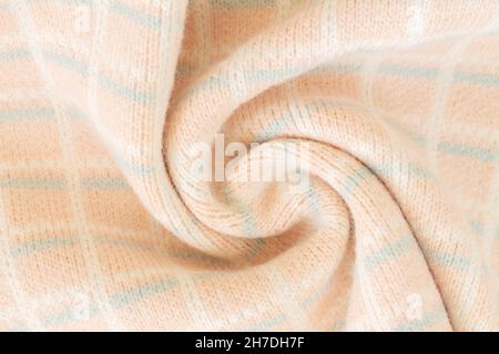 Spiralförmige Oberfläche und Textur aus warmem Wollstoff Probe close-up Stockfoto