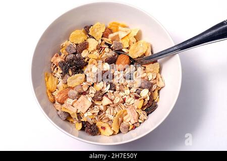 Mischung aus Haferflocken mit verschiedenen Obstsorten zum Frühstück Stockfoto