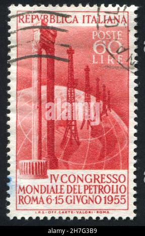 ITALIEN - UM 1955: Stempel gedruckt von Italien, zeigt Marmorsäulen und Ölfeld auf Globus, um 1955 Stockfoto