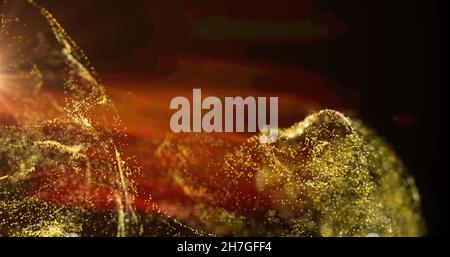 Bild von gelber Partikelwolke und orangefarbenem Licht auf schwarzem Hintergrund Stockfoto