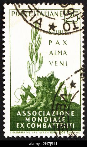 ITALIEN - UM 1959: Eine in Italien gedruckte Marke zeigt A Gentle Peace has Come, International war Veterans Association Convention, Rom, um 1959 Stockfoto
