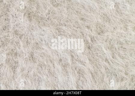 Grauer Alpaka-Stoff, Mohair-Wolle oder strukturierter Angora-Hintergrund Stockfoto