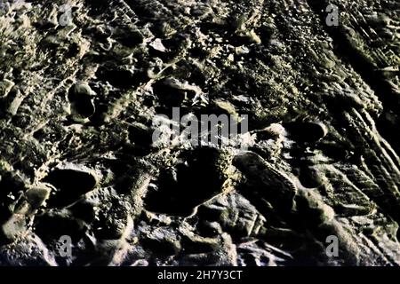 Texturen von Sandoberfläche am Strand Stockfoto