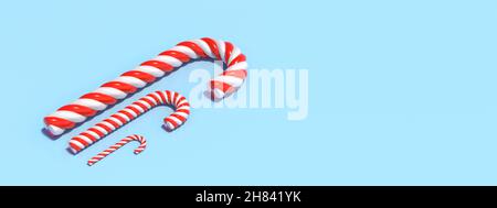 Weihnachtsbonbons auf pastellblauem Hintergrund, Platz. Vorlage für die Weihnachtskarte. Pfefferminzrot weiß gestreifte traditionelle Süßigkeiten für Kinder. 3D illustrati Stockfoto