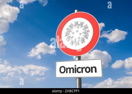 Neue Mutation des Corona-Virus namens 'omicron' B.1.1.529: Corona-Virus - Schematische Darstellung eines Virus auf einem No-Entry-Zeichen mit dem Text 'Omicron' unten Stockfoto