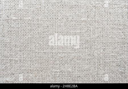 Hintergrund aus Chintz, hellgrauer Kali. Nähmaterial. Weißer Leinwandtextur-Hintergrund mit zart gestreiftem nahtlosem Muster. Stoff. Stoff Stockfoto