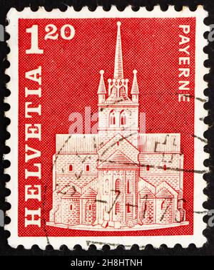 SCHWEIZ - UM 1968: Eine in der Schweiz gedruckte Briefmarke zeigt Abteikirche, Payerne, Schweiz, um 1968 Stockfoto