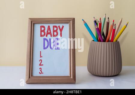 Konzeptionelle Bildunterschrift Baby Due. Geschäftsansatz im Begriff, unter Engagement geboren werden, wie die Zeit erwartet, um bereit sein leeren Bilderrahmen mit Einem bunten Stockfoto