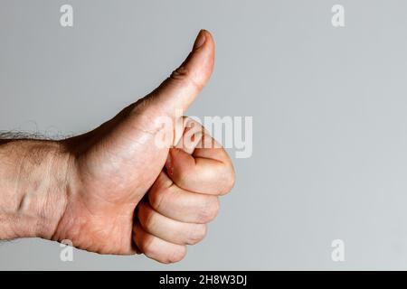 Hand mit Daumen Stockfoto