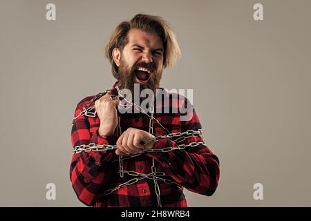 Leidend Mann angekettet fühlen Krämpfe und Muskelkrämpfe, versuchen, sich zu befreien Stockfoto