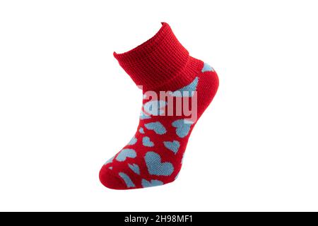 Mehrfarbige Socken auf weißem Hintergrund. Blick von oben. Viele verschiedene Socken für die kalte Jahreszeit. Socken sind auf einem hellen Hintergrund verstreut. Socken o Stockfoto