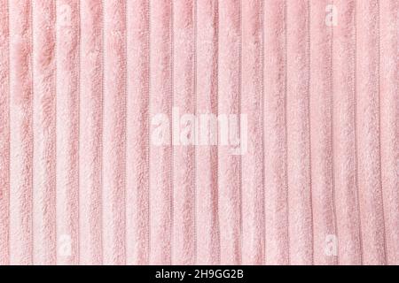 Weiche, pastellrosa Fleece-Überwurf-Qualität mit Linien. Textur für gemütlichen Winter Hintergrund Stockfoto