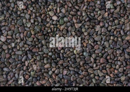 Dekorative Kieselsteine, dunkelblaue Farbe Steine Hintergrund Textur, Tapete abstrakt Stockfoto