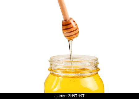 Dipper mit Honig in Frauenhand. Platz für Text oder Design. Stockfoto