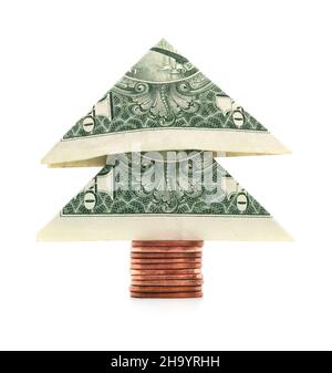 Isolierter Weihnachtsbaum mit einem Dollar-Schein auf weißem Hintergrund. Stockfoto