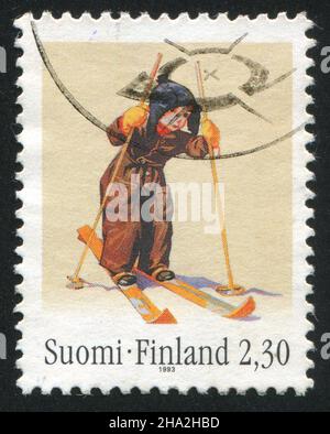 FINNLAND - UM 1993: Stempel gedruckt von Finnland, zeigt Boy auf Skiern von Martta Wendelin, um 1993 Stockfoto