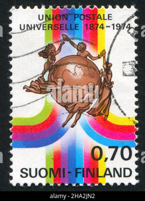 FINNLAND - UM 1974: Stempel gedruckt von Finnland, zeigt UPU-Abzeichen, um 1974 Stockfoto