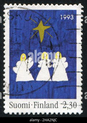 FINNLAND - UM 1993: Briefmarke gedruckt von Finnland, zeigt drei Engel, um 1993 Stockfoto