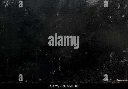 Schwarze kolossierte Gipswand Detail, grunge Hintergrund oder Textur Stockfoto