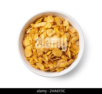 Cornflakes in einer weißen Keramikschale. Blick von direkt oben. Stockfoto