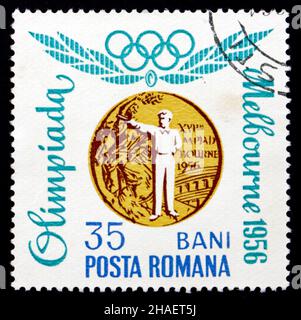 RUMÄNIEN - UM 1964: Eine in Rumänien gedruckte Briefmarke zeigt Rapid Silhouette Pistol, Melbourne 1956, rumänische olympische Goldmedaille, um 1964 Stockfoto