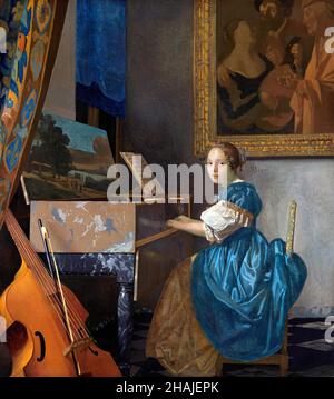 Vermeer. Gemälde mit dem Titel „Eine junge Frau sitzt an einem Jungfrauenweibl“ von Johannes Vermeer (1632-1675), Öl auf Leinwand, um 1670-72 Stockfoto