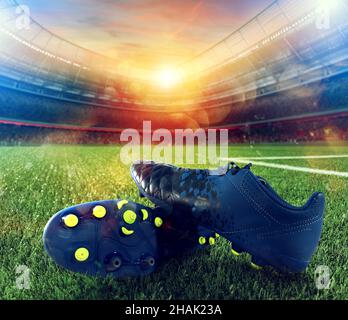 Soccer shoes on playground of a big stadium Stockfoto