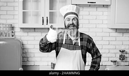 Männlicher Koch in Uniform. Kochen Sie mit der Geste der Geschmackserlaubnis. Stockfoto