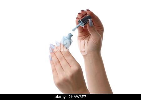 Weibliche Hände halten Nagellack isoliert auf weißem Hintergrund Stockfoto