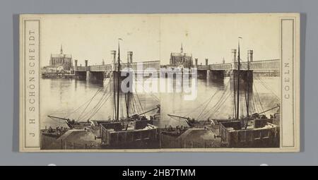 Blick auf die Dombrücke in Köln mit dem Kölner Dom im Hintergrund, Coeln (Serientitel), Johann Heinrich Schönscheidt (Objektbezeichnung), Köln, c. 1860 - c. 1870, Karton, Albumin-Print, Höhe 85 mm × Breite 170 mm Stockfoto