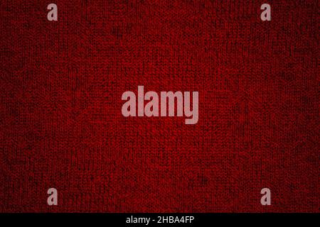 Rot gestrickte Wolle Stoff Textur Hintergrund mit Grunge Stockfoto