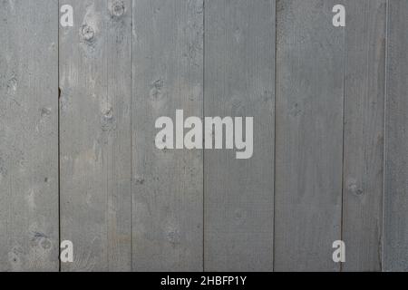 Grau lackierte Holzbretter. Textur von verwitterten grau lackierten Platten von Wand, Tisch oder Zaun, hohe Auflösung. Stockfoto