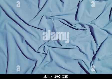 Stoff Baumwollhintergrund. Falten, Textur und Vorhänge auf der Oberfläche Textil von Kleidungsstück Warp, Polsterung und Design. Hochwertige Fotos Stockfoto