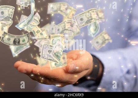 Männliche Hand hält eine Illustration der Banknoten fallen - Geschäftskonzept Stockfoto