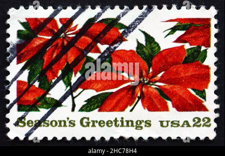 VEREINIGTE STAATEN von AMERIKA - UM 1985: Eine in den USA gedruckte Briefmarke zeigt Poinsettia, Phribia pulcherrima, Weihnachten, um 1985 Stockfoto