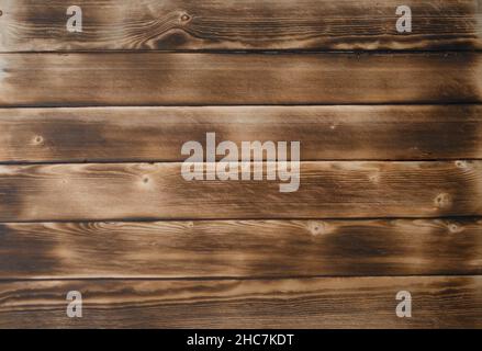 Verbrannte alte Platine. Texturbretter aus dunkelbraunem altem Holz. Stockfoto