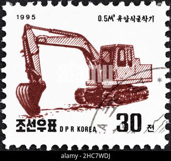 NORDKOREA - UM 1995: Eine in Nordkorea gedruckte Marke aus der 'Machines'-Ausgabe zeigt Excavator, um 1995.