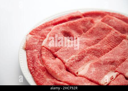 Rohes Rindfleisch japanisches schwarzes Wagyu-Fleisch isoliert auf weißem Hintergrund Stockfoto