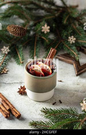 New Year still life with Traditional Xmas holiday hot drink Mulled vine with new year decorations on textured background Stockfoto