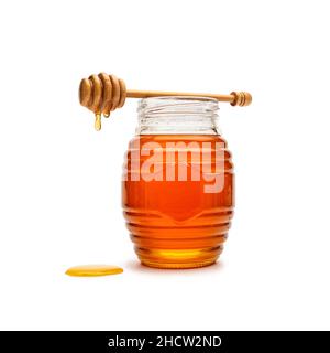 Glas voller Honig aus Holz Honig Dipper Stockfoto
