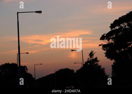 Die Strandpromenade von Clontarf bei Sonnenuntergang Stockfoto