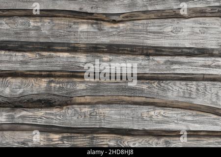 Detail der alten verwitterten Holzhütte oder der hölzernen Hüttenwand Stockfoto