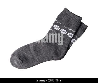 Neue graue Wollsocken isoliert auf weißem Hintergrund. Warme Socken mit weißem Blumenmuster in Nahaufnahme. Strumpfwaren Design Element für aktiven Lebensstil Stockfoto